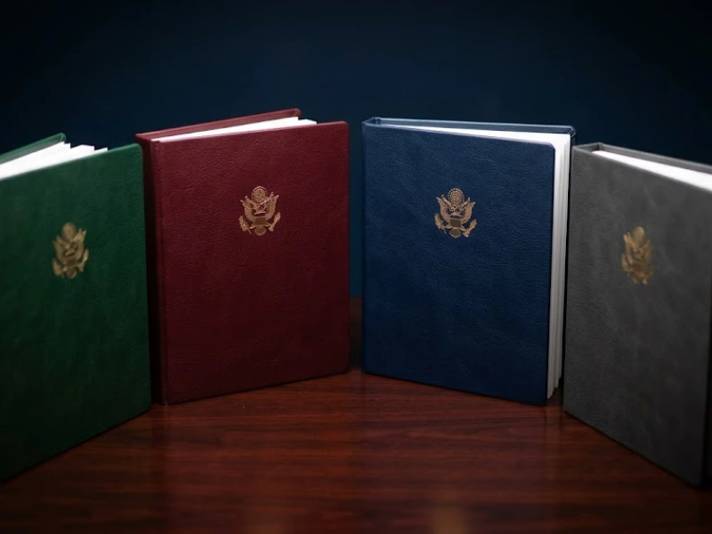 Four leather binders with US eagle seals representing entity return types for business tax preparation Vancouver WA
